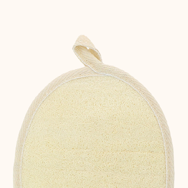 Zoom sur le gant de massage exfoliant en loofah de chez JCH Respect.